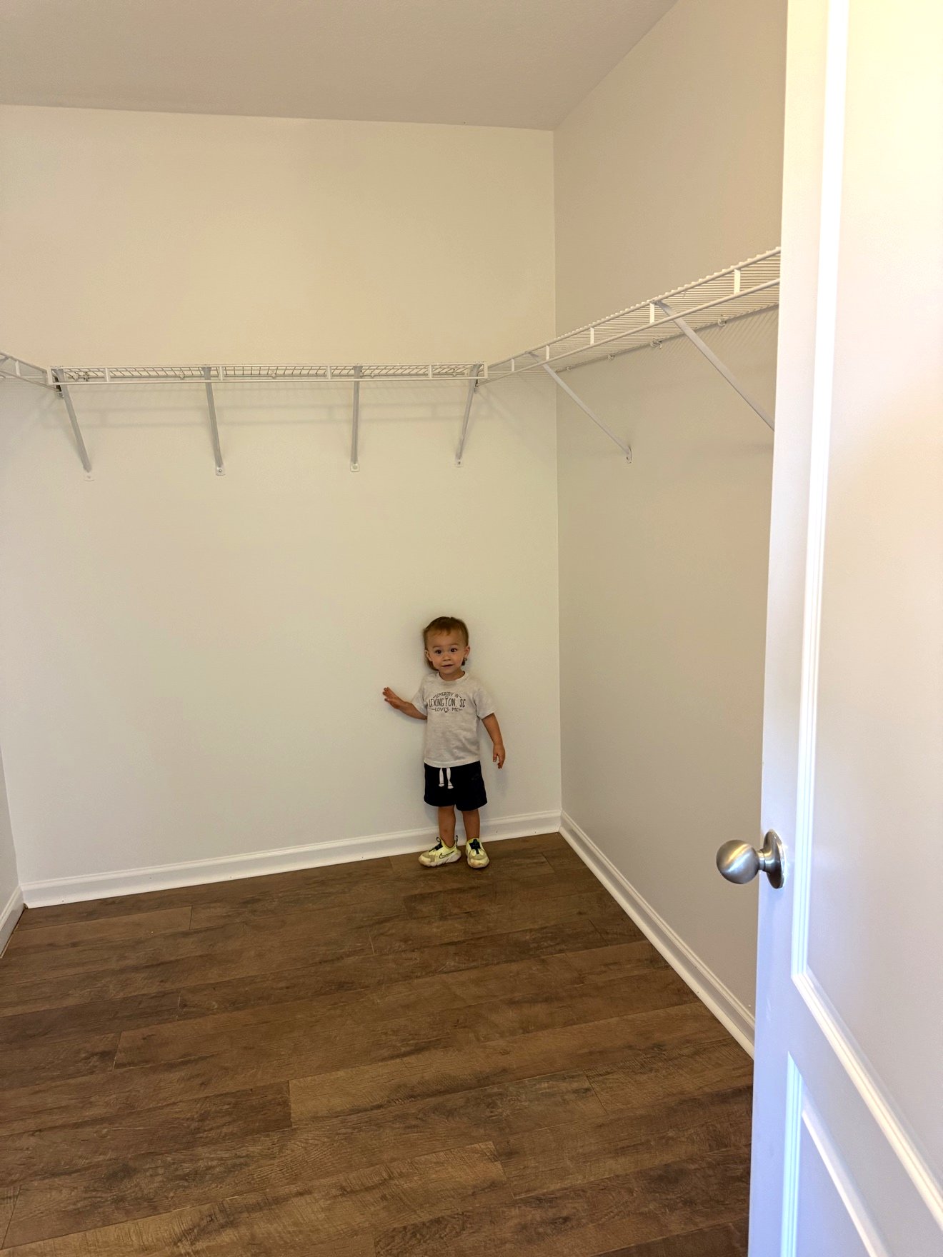 Finished closet with new luxury vinyl plank flooring