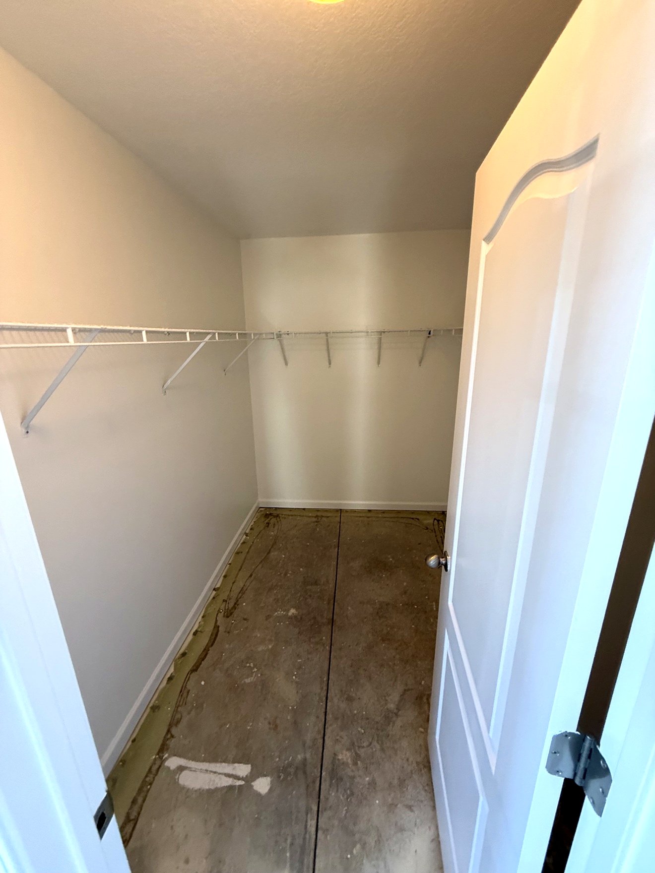 Closet during tear-out with the subfloor exposed